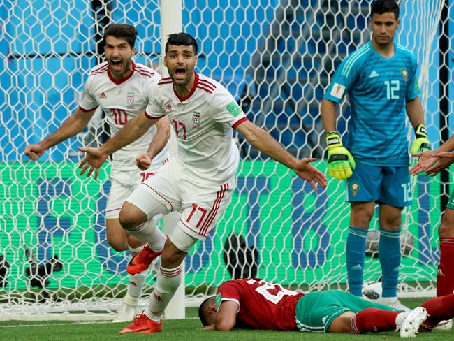 Iran players celebrate their incredible success.