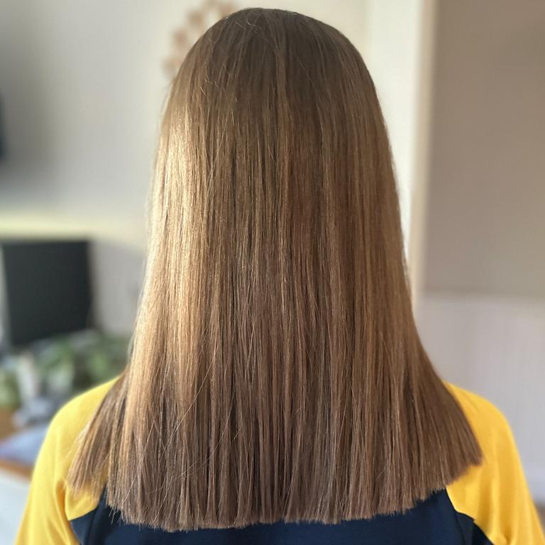 The program creates wigs for kids with cancer using donated hair, in this case from Elsie’s first ever proper haircut. Picture: supplied