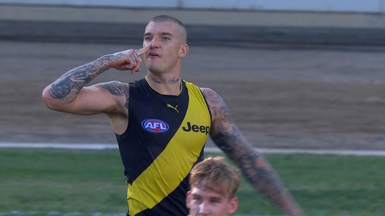 Dustin Martin imitates a snorting action.