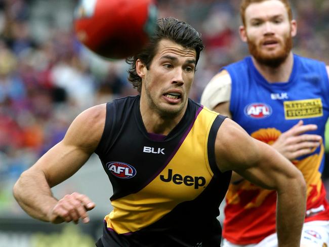 Alex Rance leads Daniel Merrett to the ball. Picture: Wayne Ludbey