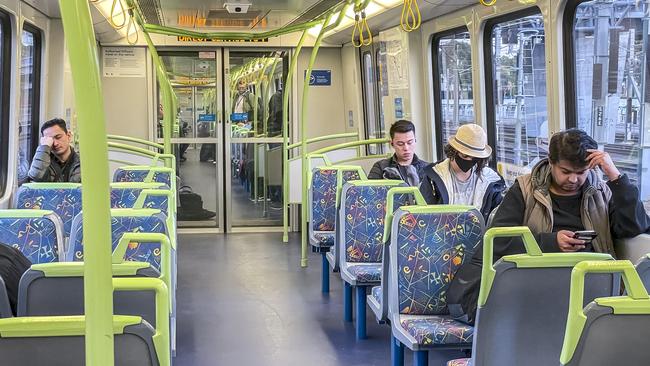 The rates of people wearing masks on trains and trams has almost halved. Picture: Jake Nowakowski.