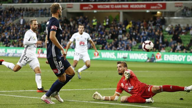 Ola Toivonen kicks the ball past Wellington Phoenix goalkeeper Filip Kurto. 