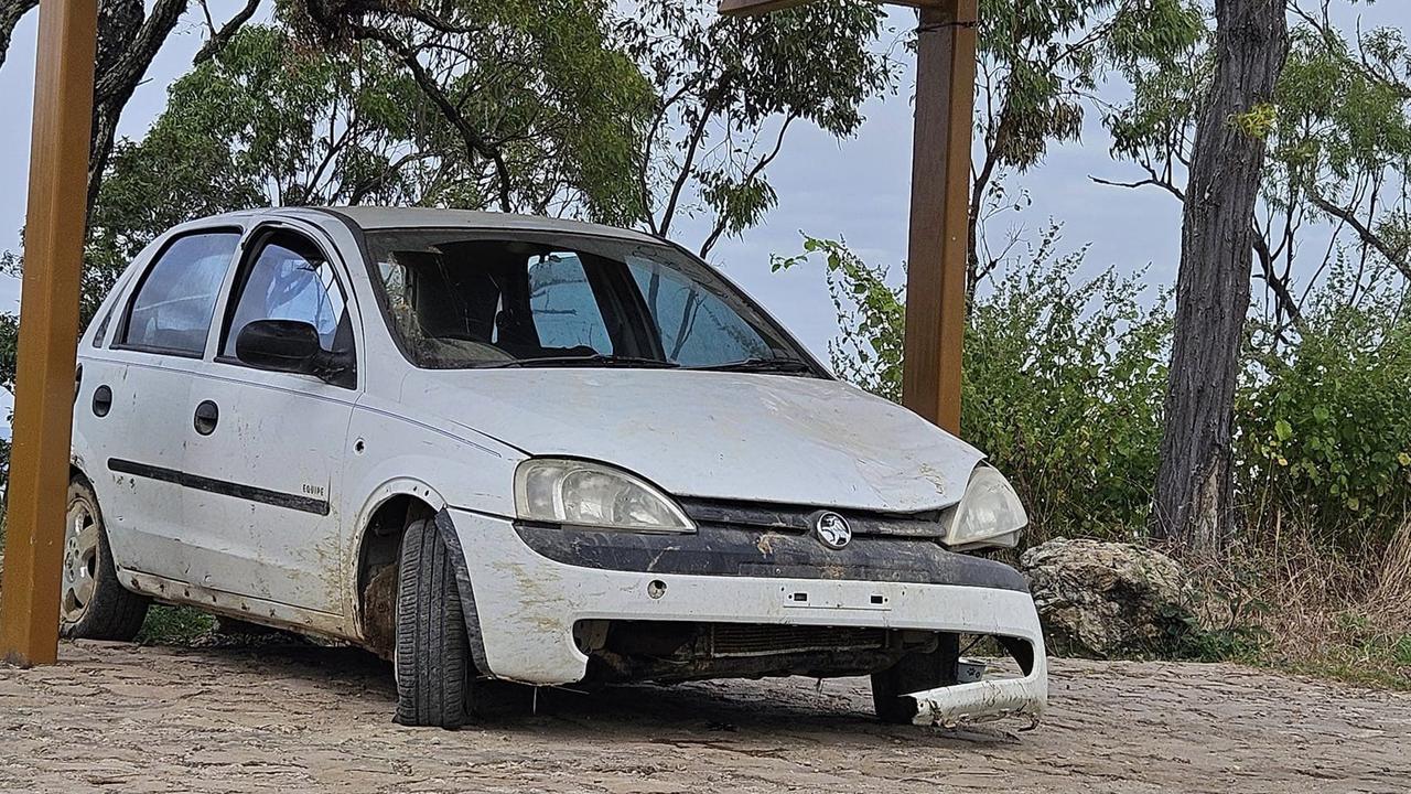 Battered car baffles walkers on Mount Louisa as council mulls removal ...