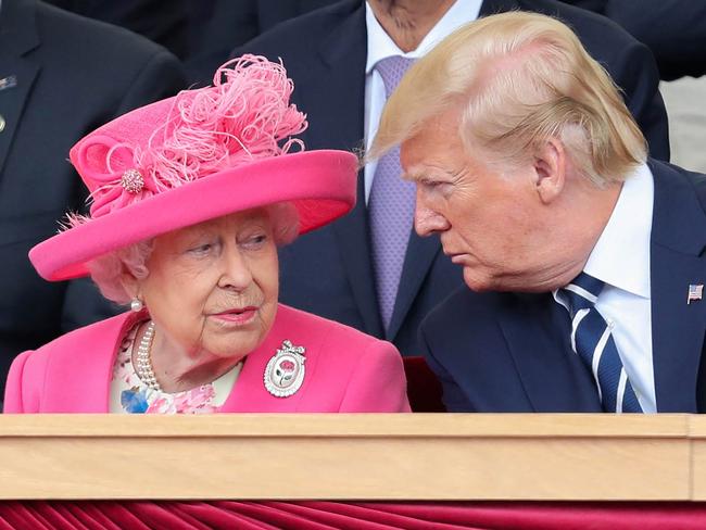 Queen Elizabeth II reacts as she sits with former US president Donald Trump. Picture: AFP