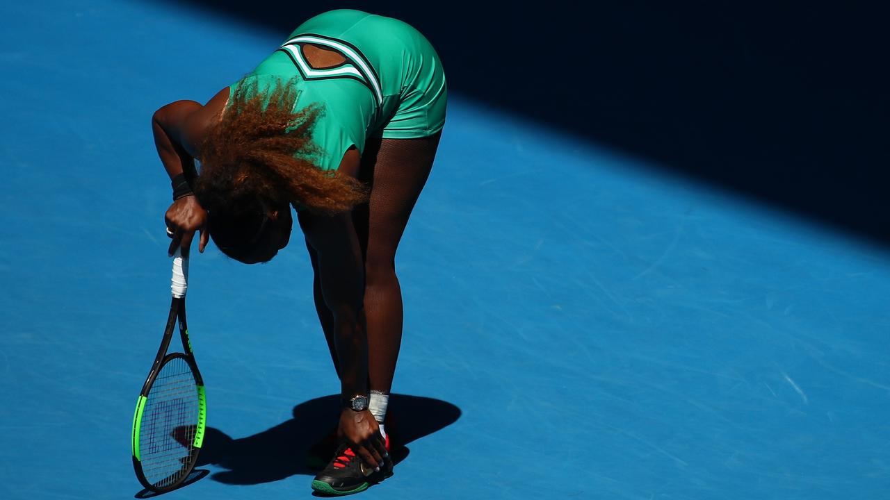 Serena Williams holds her ankle in her quarterfinal match against Karolina Pliskova.