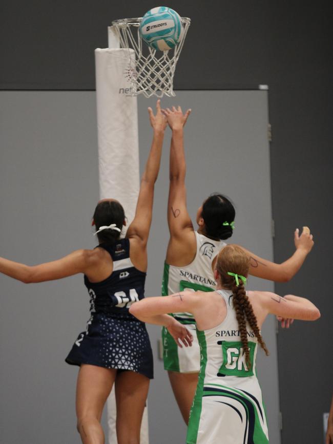 QISSN 2024 division one grand final - Canterbury College v Somerset College. Pictured: Kaylee Tamala and Maddy Rhind go for rebound