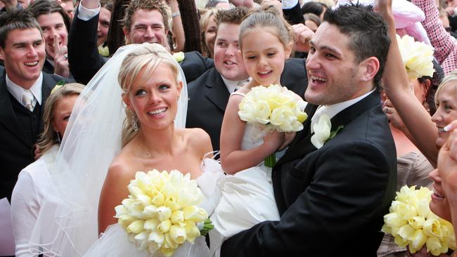 Brendan and Alex with her daughter Mia on their wedding day in 2005.