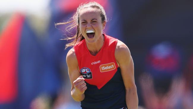 Daisy Pearce of the Demons celebrates the win.