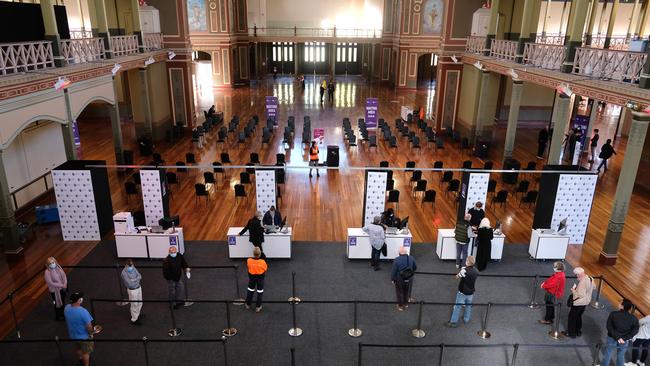 People attend a mass vaccination hub at Melbourne’s Royal Exhibition Building. Picture: Getty