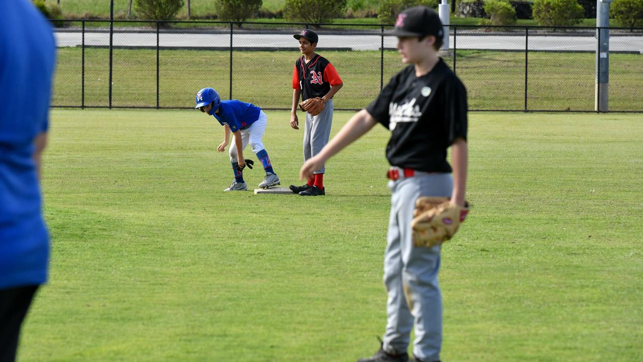 A Lismore Worker's Baseballer sussing out opportunity to steal third base in a friendly against North's Baseball Club at Albert Park in Lismore on Saturday. Picture: Cath Piltz