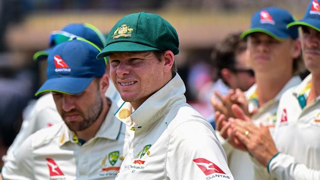 Australia's captain Steve Smith (C) along with his teammates, stands during the presentation ceremony at the end of the second Test cricket match between Sri Lanka and Australia at the Galle International Cricket Stadium in Galle on February 9, 2025. Australia won the second Test against Sri Lanka by nine wickets in Galle on February 9, to sweep the series 2-0. (Photo by Ishara S. KODIKARA / AFP)