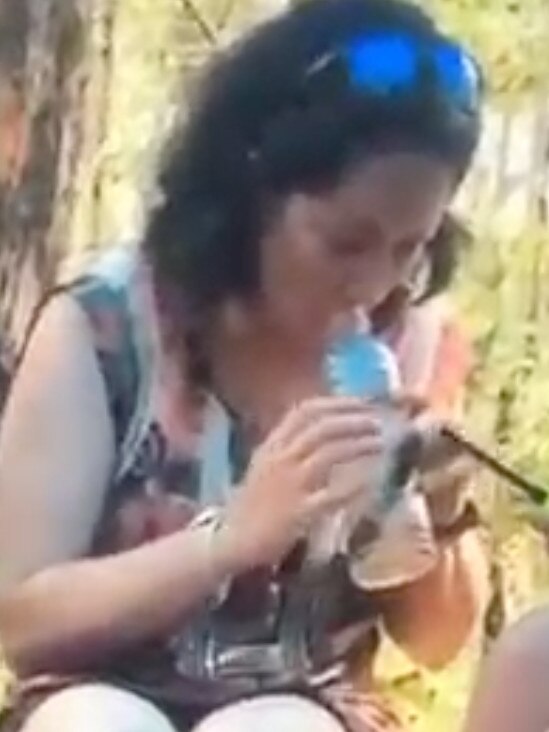 Screen grabs from footage that surfaced of Lucas Heights teacher Lauren Russell with students in school uniform. She appears to be smoking a bong.