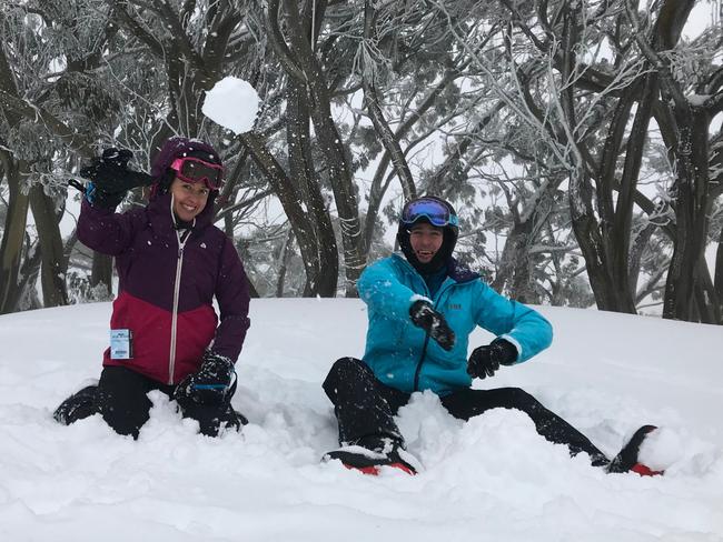 Friends Sarah Fisher and Harry Waters from Richmond make the most of being snowed-in at Mt Baw Baw. Picture: Ash Argoon