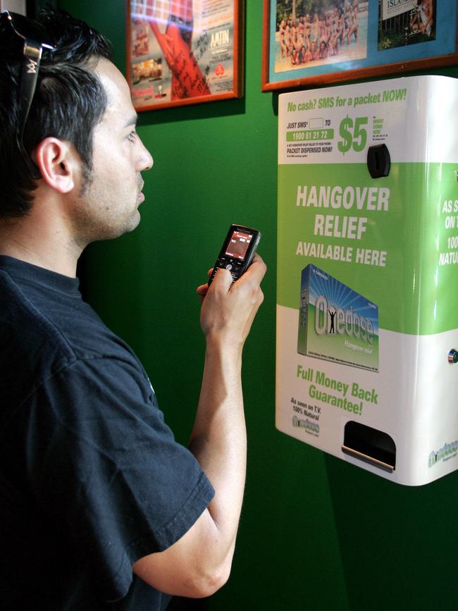 Robert Paul Davies, now named Paul Vickery, with a hangover relief vending machine.