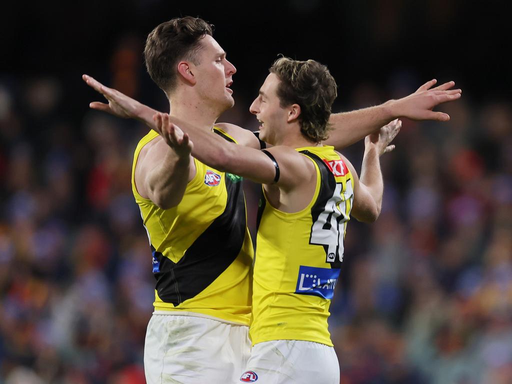 Jacob Koschitzke and Tyler Sonsie celebrate a Richmond goal on Thursday night. Picture: James Elsby/AFL Photos via Getty Images