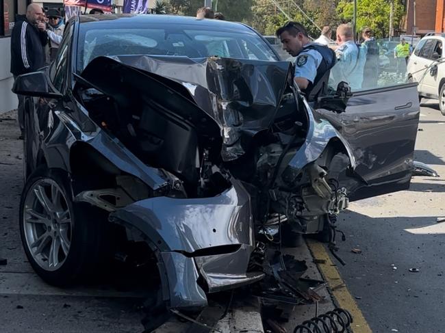 A Tesla was left destroyed after it ploughed into a powerpole in Bankstown's CBD. Picture: Supplied