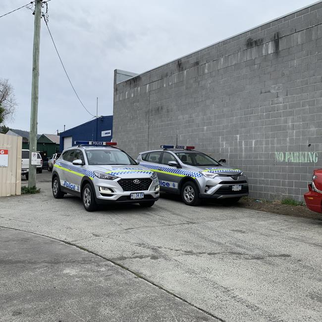 Police cars at the scene of one of the raids. Picture: JAMES KITTO