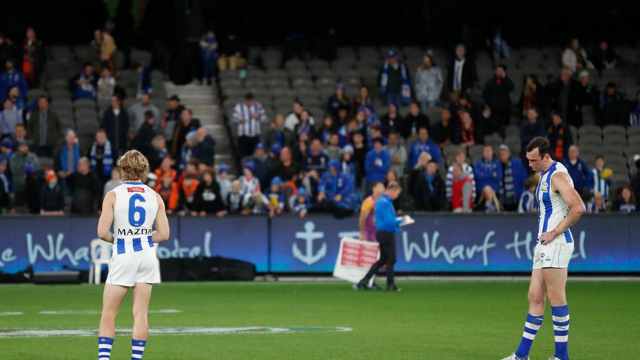 The remaining fans are shown behind Jason Horne-Francis and Todd Goldstein after North Melbourne’s loss.