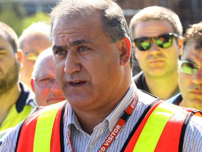 Victorian state secretary of the AWU, Cesar Melhem stands with BlueScope Steel workers in Hastings which today announced 200 job cuts.