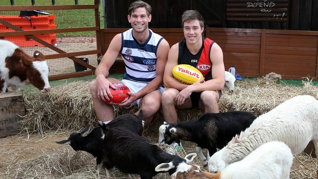 Geelong’s Tom Hawkins and Essendon’s Zach Merrett at yesterday’s launch of the country round outside the MCG. Picture: Yuri Kouzmin.