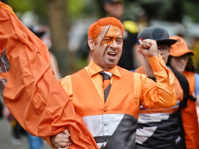 A lone GWS supporter walks into the Melbournes MCG ahead of their clash with GWS. Picture: Jason Edwards