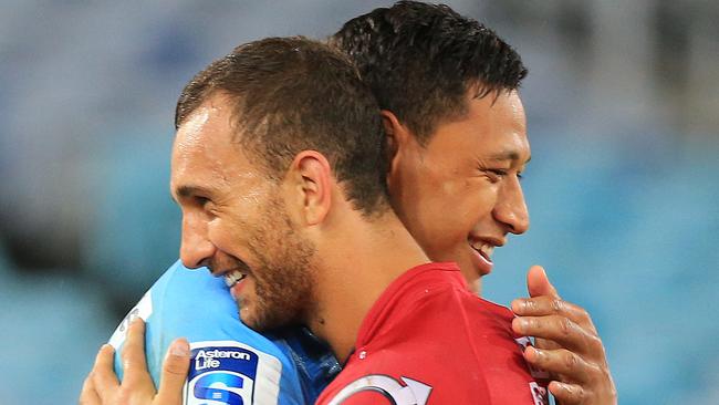 Israel Folau and Quade Cooper after a Super Rugby match between the Waratahs and Reds. Picture: Mark Evans