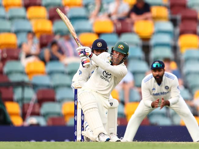 Alex Carey hits out at the Gabba. Picture: Chris Hyde/Getty Images.