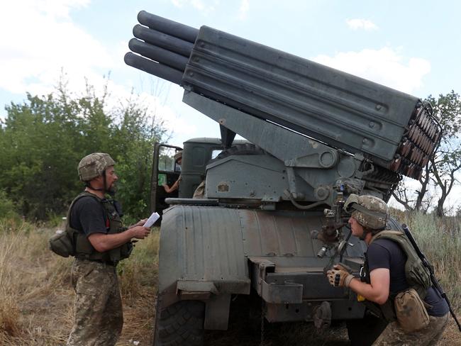 Ukrainian servicemen prepare to fire a Grad BM-21 multiple rocket launcher at the front line between Russian and Ukraine forces in the countryside of the eastern Ukrainian region of Donbas. Picture: AFP