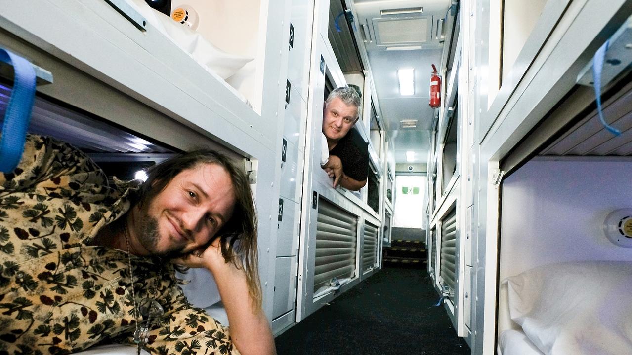 The bus will have “up to 20 secure, climate controlled, individual sleep pods with a lockable door and toilet.” Pictured: Founder Simon Rowe (at the back) with James Wright. Photo: Jeff Dawson/ Echo Publications.