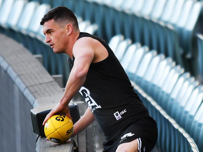 ADELAIDE, AUSTRALIA - JULY 24: Tom Rockliff of Port Adelaide retrieves a ball during a Port Adelaide Power AFL training session at the Adelaide Oval on July 24, 2020 in Adelaide, Australia. (Photo by Mark Brake/Getty Images)