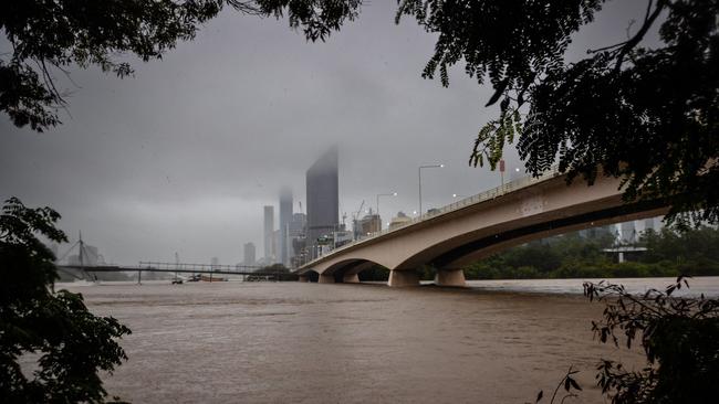 The overflowing Brisbane River is seen from South Bank, Picture: AFP