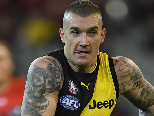 Dustin Martin of the Tigers is seen in action during the Round 5 AFL match between the Melbourne Demons and the Richmond Tigers at the MCG in Melbourne, Tuesday, April 24, 2018. (AAP Image/Julian Smith) NO ARCHIVING, EDITORIAL USE ONLY