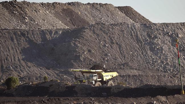 A large truck driving through an open-cut coal mine in Singleton in the Hunter Valley north of Sydney. Picture: William West