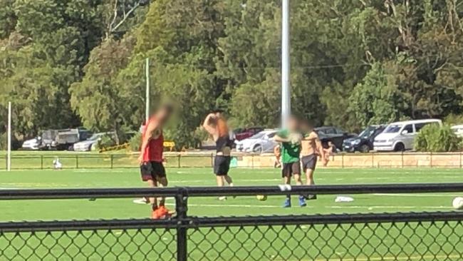 A group of four men practising their football skills at Lionel Watts Reserve, Frenchs Forest on Saturday. Picture: Jim O'Rourke