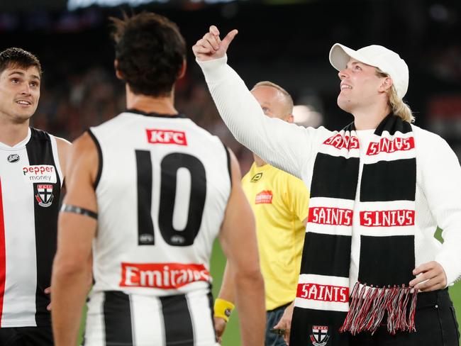 Jackson Warne tosses the coin during the match in Melbourne. Picture: Michael Willson/AFL Photos via Getty Images