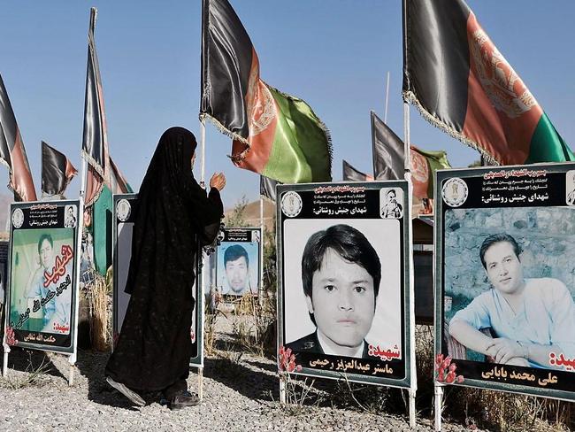 A woman prays at the graves of victims of a of attacks in Kabul last week.