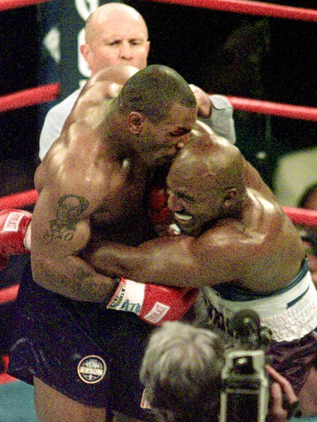 Mike Tyson biting the ear of Evander Holyfield