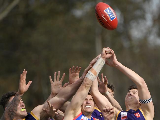 Players contest for the ball during grand final. Picture: Andy Brownbill