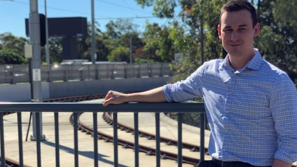 Bonney MP Sam O'Connor outside what would be the start of a spur line to Harbour Town on the Gold Coast for light rail.