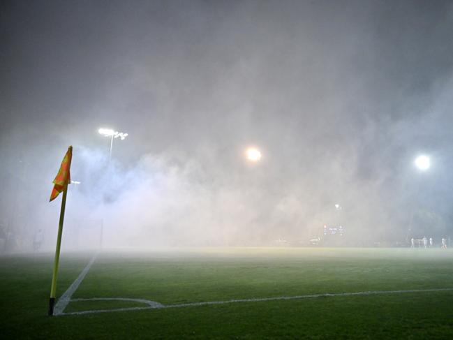 BRISBANE, AUSTRALIA - AUGUST 27: A general view is seen of the field after were flares were thrown into the pitch during the 2024 Australia Cup Round of 16 match between Lions FC and Western Sydney Wanderers FC at Luxury Paints Stadium, on August 27, 2024 in Brisbane, Australia. (Photo by Albert Perez/Getty Images)