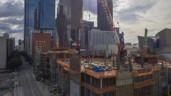 Downtown construction continues in downtown Los Angeles after a statewide stay at home order was issued for California’s 40 million residents. Picture: Getty