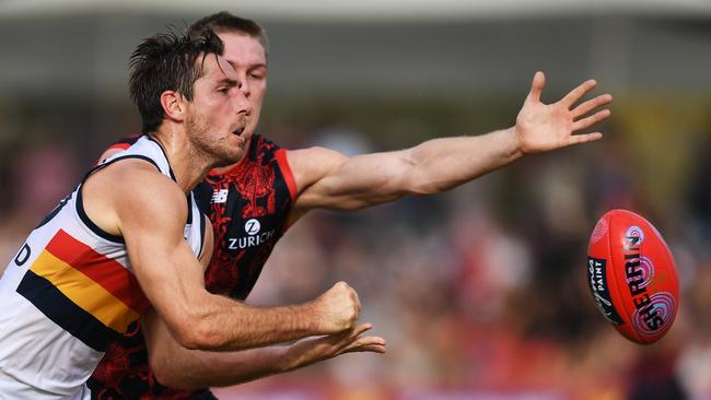 Richard Douglas handballs clear ona tough day for the Crows. Pic: AAP