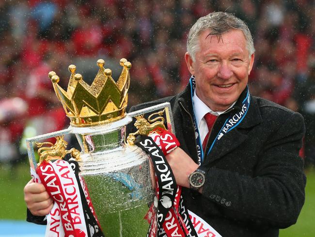 FILE: Former Manchester United manager, Sir Alex Ferguson has had emergency surgery for a brain haemorrhage. MANCHESTER, ENGLAND - MAY 12:  Manchester United Manager Sir Alex Ferguson celebrates with the Premier League trophy following the Barclays Premier League match between Manchester United and Swansea City at Old Trafford on May 12, 2013 in Manchester, England.  (Photo by Alex Livesey/Getty Images)