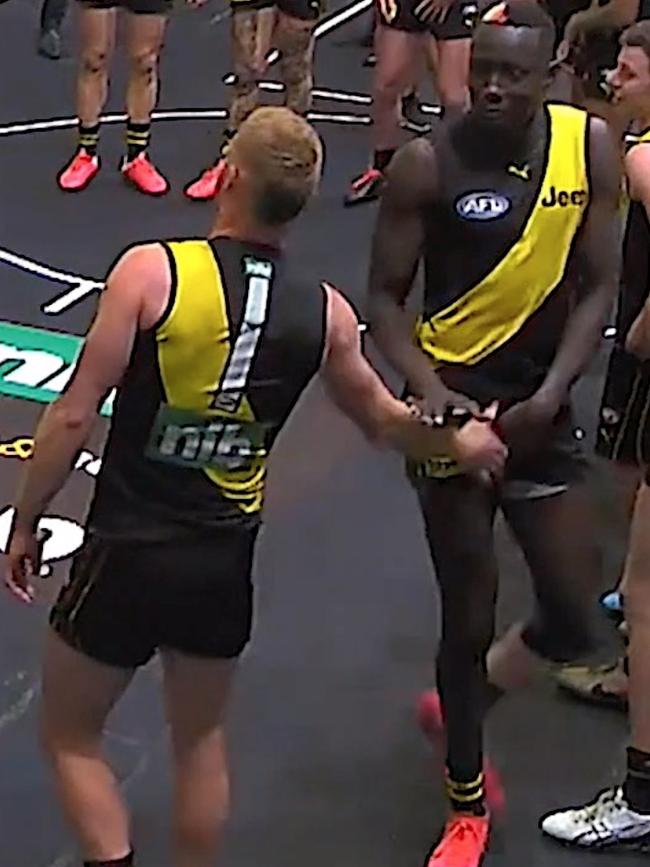 Nick Vlastuin touches Chol after the win against Brisbane.