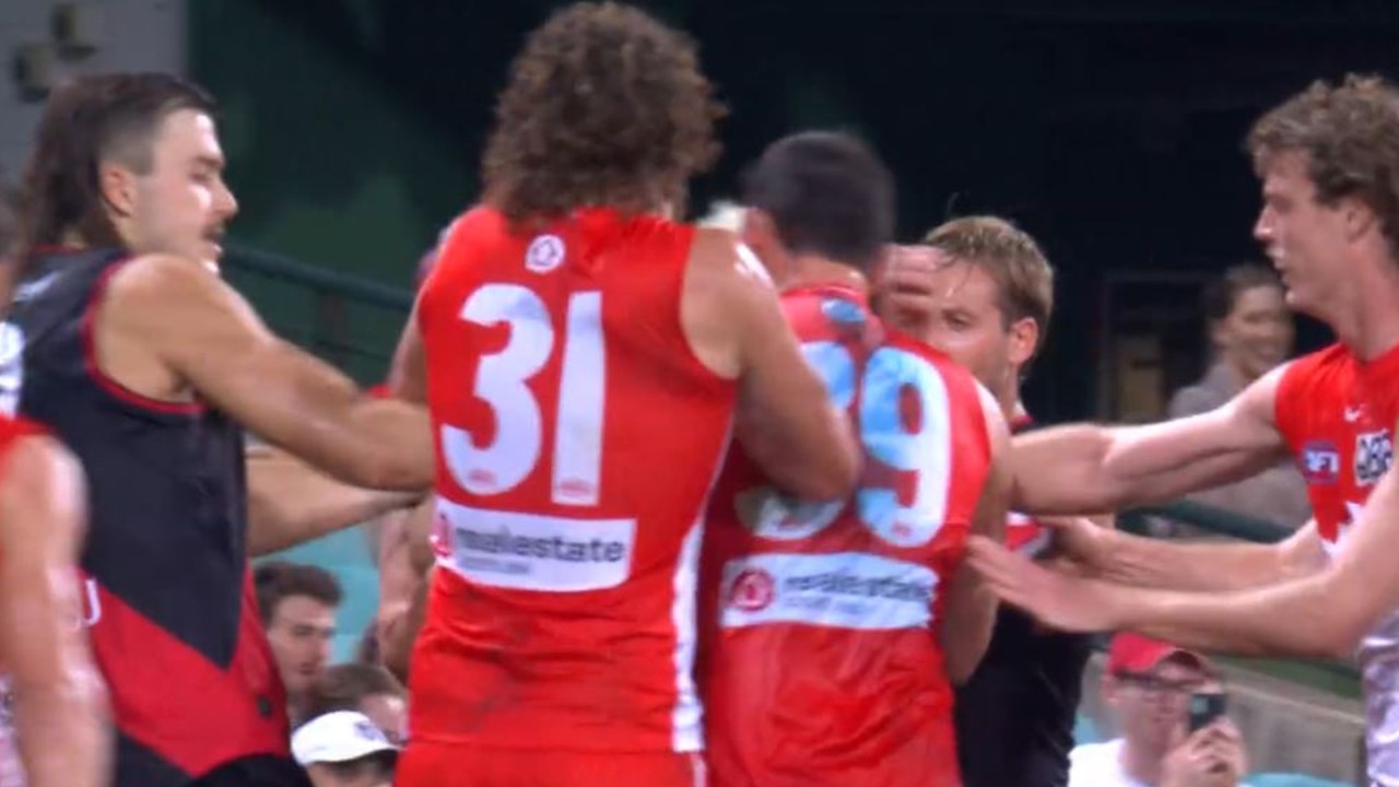 Essendon and Sydney players wrestle after the sickening bump. Picture: Supplied