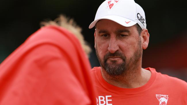 SYDNEY, AUSTRALIA - FEBRUARY 21: Dean Cox, coach of the Sydney Swans speaks with Callum Mills during the AFL practice match between Sydney Swans and Greater Western Sydney Giants at Tramway Oval on February 21, 2025 in Sydney, Australia. (Photo by Darrian Traynor/Getty Images)