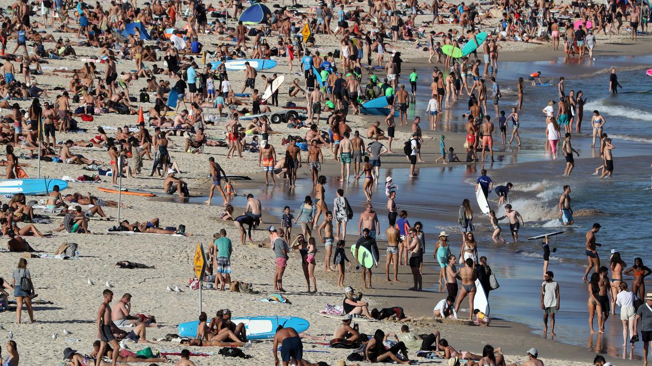 Enormous crowds flocked to Bondi Beach as the temperature reached 34 degrees Celsius. Picture: Jonathan Ng