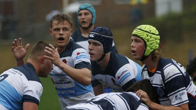 Action in the NSW Barbarians (blue and white) v Victoria game.