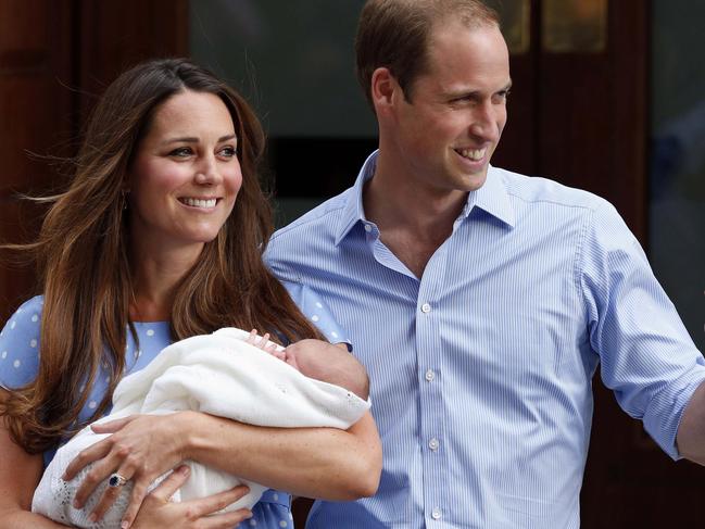 FILE - In this Tuesday, July 23, 2013 file photo, Britain's Prince William and Kate, Duchess of Cambridge hold their new born son George, as they pose for photographers outside St. Mary's Hospital exclusive Lindo Wing in London where the Duchess gave birth. Boy or Girl? Even the Duke and Duchess of Cambridge are professing they will be as surprised as the rest of us. An aide to Prince William and the former Kate Middleton say Prince George is eagerly awaiting a new brother or sister later this month, though they say they don’t know which it will be. (AP Photo/Lefteris Pitarakis, File)