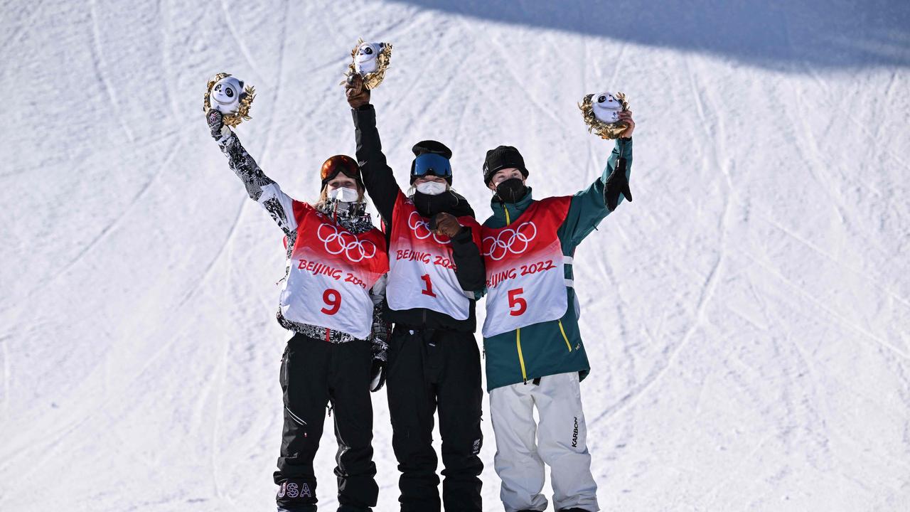 USA's Julia Marino, New Zealand's Zoi Sadowski Synnott and Tess Coady celebrate together. Photo by Ben STANSALL / AFP.